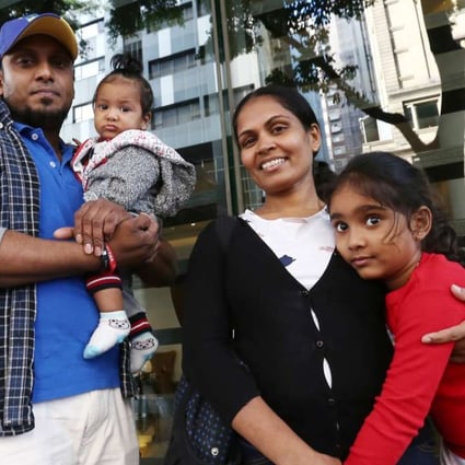 From left, Supun Thilina Kellapatha, his seven-month-old son Dinath, wife Nadeeka Dilrukshi Nonis and daughter Sethumdi, five. The family gave shelter to Edward Snowden during his time in the city in 2013. years old, poses for a picture in Wan Chai. Ajith who sheltered Snowden in Hong Kong. 02DEC16 SCMP / Photo: Jonathan Wong