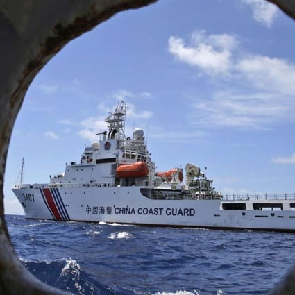 A Chinese coastguard ship is seen from a Philippine government vessel in the South China Sea in March 2014. Photo: AP