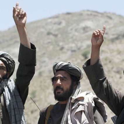 Taliban fighters react to a speech by their senior leader in the Shindand district of Herat province, Afghanistan. Photo: AP