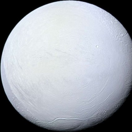 Saturn's moon Enceladus, covered in snow and ice, resembles a perfectly packed snowball in this image from Nasa's Cassini mission. Earth may have looked similar more than 600 million years ago. Photo: Nasa