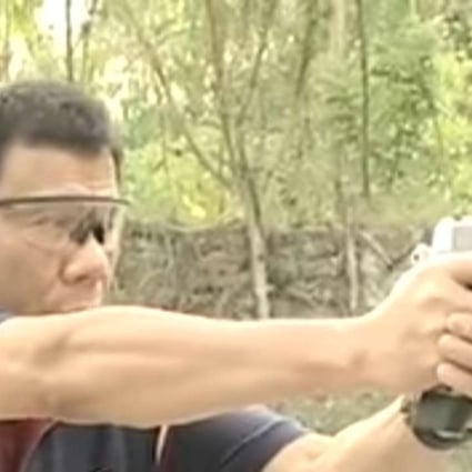 Rodrigo Duterte fires a pistol at a shooting range. The Philippine president said he personally killed suspected criminals when he was mayor of a southern city to set an example for police. Photo: YouTube