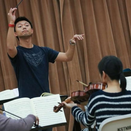 Philip Chu leads his chorus in rehearsals for The Messiah. Photo: Felix Wong