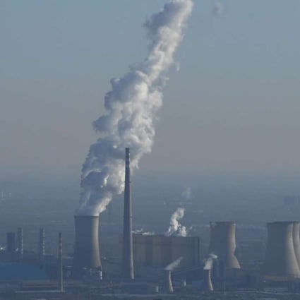 A power plant on the outskirts of Beijing on Friday. China has passed legislation to tax factories, power plants and other pollution emitters for the contaminants they release. Photo: AFP