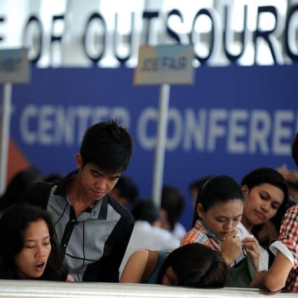 Job seekers at a recruitment fair for call centre agents in Manila. The rapid expansion of the Philippine BPO industry is giving young Filipinos the chance to find middle-class jobs that previously only existed outside the country. Photo: AFP