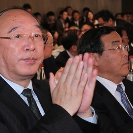 Huang Qifan (left) pictured at an event in Hong Kong while serving as mayor of Chongqing in 2013. Photo: SCMP Pictures
