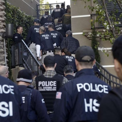 A file picture of US federal agents raiding a suspected “birth tourism” hotel in Irvine, California, in March 2015. Photo: AP