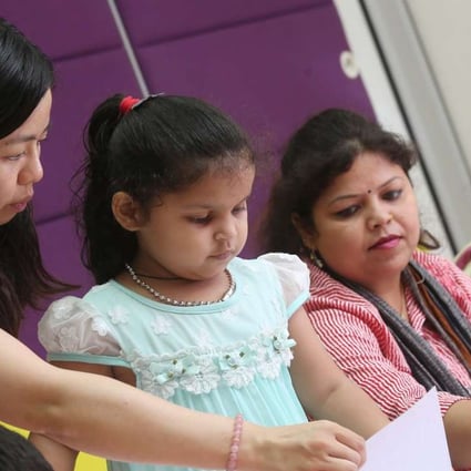 Parents learn Chinese with their children under a Jockey Club language programme at the HKSPC Children & Family Services Centre in Kowloon City. Photo: K.Y. Cheng