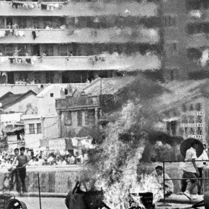 Demonstrators burn the bamboo baskets during the Hong Kong riots in 1967.
