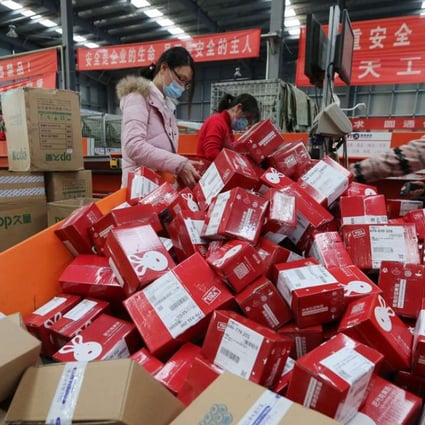 Workers packaging goods for delivery at a sorting centre in Lianyungang, Jiangsu province, during the Singles’ Day online shopping festival on November 11, 2016. Photo: AFP