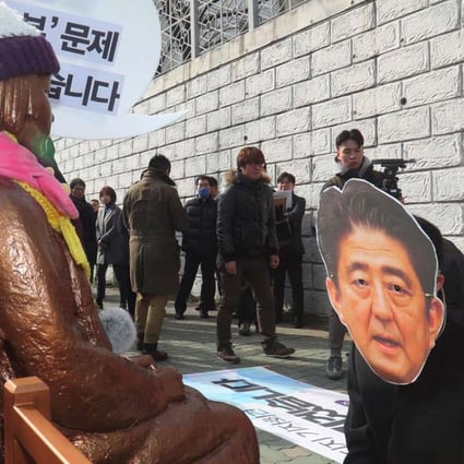 A South Korean protester wearing a mask of Japanese Prime Minister Shinzo Abe kneels in mock apology in front of the ‘comfort women’ statue outside the Japanese consulate in Busan. The statue symbolises the women who served as sex slaves for Japanese soldiers during the second world war. Photo: AFP