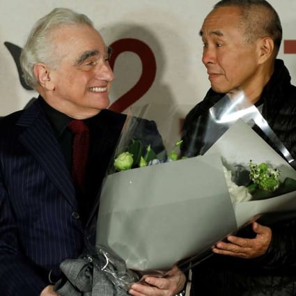 Director Martin Scorsese receives flowers from Taiwanese director Hou Hsiao-Hsien during the premiere of Silence in Taipei on January 19. Photo: Reuters