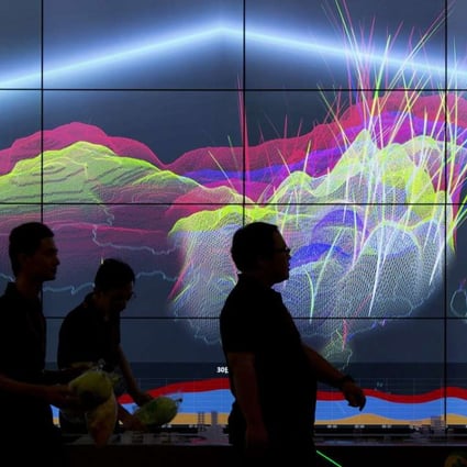 Attendees walk past a live visualisation of internet attacks across China during the 4th China Internet Security Conference in Beijing in August 2016. Photo: AP