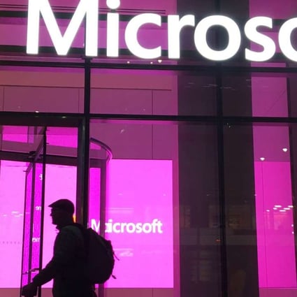 People walk near a Microsoft office in New York. Photo: AP