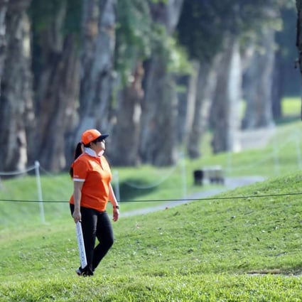 A staff member walks around the Fanling course during the Hong Kong Open golf tournament in 2015. Photo: Edward Wong