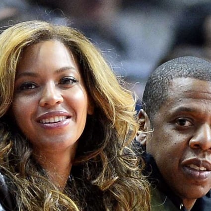 US singers Beyonce (L) and her husband Jay Z (R) sit courtside at the Brooklyn Nets at Los Angeles Clippers NBA basketball game in Los Angeles, California. Beyonce Knowles is pregnant with twins as she and her husband Jay Z confirmed via social media. Photo: EPA