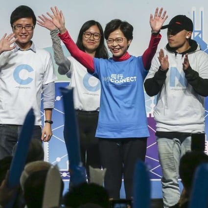 Carrie Lam (middle) at a campaign event held at the Convention and Exhibition Centre on Friday. Photo: Sam Tsang
