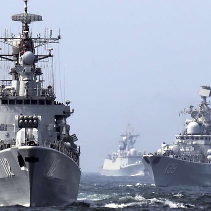 The guided missile destroyer Harbin (left) was part of the Chinese navy task force that left Kuwait on Sunday after visits to four Persian Gulf states. Photo: AP