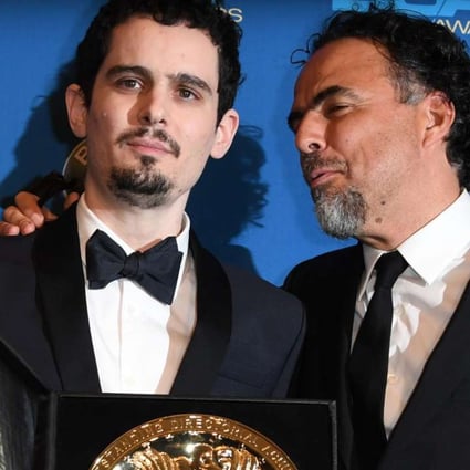 Damien Chazelle (left), winner of the Best Director in a Feature Film Award for La La Land, poses with last year's winner, director Alejandro Gonzalez Inarritu, at the 69th annual Directors’ Guild Awards on Saturday. Photo: AFP
