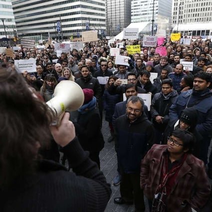 Comcast employees protest President Donald Trump's executive order banning refugees as well as immigrants from seven majority Muslim countries, at Dilworth Park in Philadelphia. Photo: David Maialetti/The Philadelphia Inquirer via AP