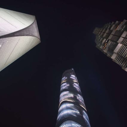 The Shanghai World Financial Center (left), the Shanghai Tower (centre) and the Jin Mao Tower stand illuminated at night in the Lujiazui district of Shanghai. Seven of the 20 tallest buildings in the world are on mainland Chinese soil. Photo: Bloomberg