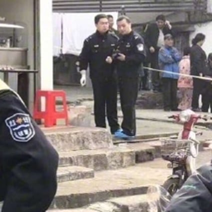 Police attend the noodle store in Wuhan where the owner was beheaded by a customer. Photo: Handout