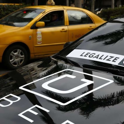 An Uber driver joins a protest calling for the legalisation of Uber in Taipei earlier this month. Photo: EPA