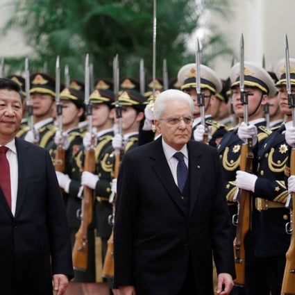 Italian President Sergio Mattarella, right, and Chinese President Xi Jinping inspect an honour guard during a welcoming ceremony for Mattarella at the Great Hall of the People in Beijing, China, on Wednesday. Photo: Reuters