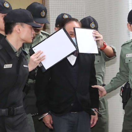 Former chief executive Donald Tsang Yam-kuen being escorted to a prison van by correctional officers. Photo: Edward Wong