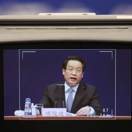 Xiang Junbo, Chairman of the China Insurance Regulatory Commission, speaking at his first public appearance since January 12, where he chimed in on a war of words against illicit fund raising by insurance companies, vowing to crack down on companies that breach the regulator’s rules.Photo: Simon Song