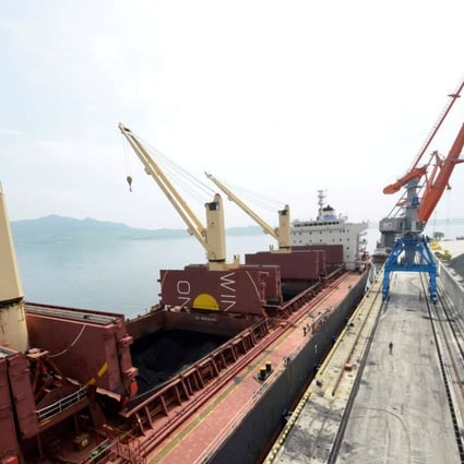 A cargo ship is loaded with coal during the opening ceremony of a new dock at the North Korean port of Rajinin 2014. Coal is estimated to take up as much as 40 per cent of North Korea’s exports to China. Photo: Reuters