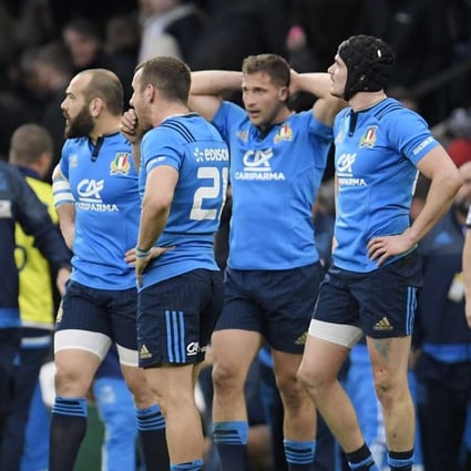 Italy’s Giorgio Bronzini and with teammates look dejected after the loss to England. Photo: Reuters