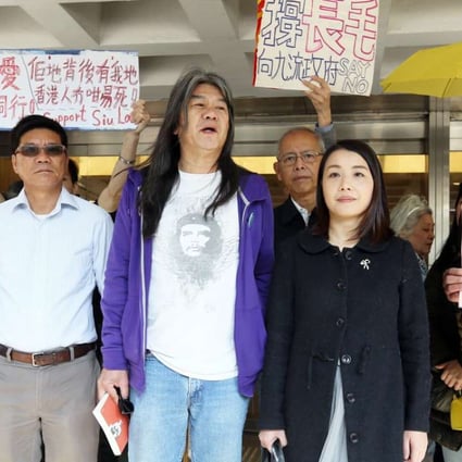 Lawmakers Leung Kwok-hung (third from left) and Lau Siu-lai to his left outside the High Court. Photo: Dickson Lee