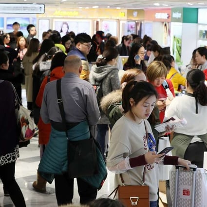 Chinese shoppers crowd a Lotte Duty Free shop in downtown Seoul. The company has a major presence in China, where there has been a backlash against it. Photo: EPA