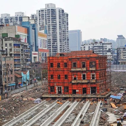 A historical building being moved to make way for new construction in Wuhan, Hubei Province, one of the second-tier cities that have been leading land sales this year. Photo: Reuters
