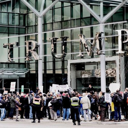 Protesters stage a rally at the entrance to the Trump International Hotel and Tower in Vancouver during opening day on February 28, 2017. Photo: AFP