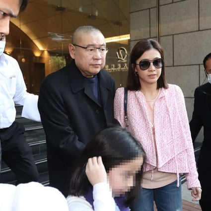 Former chairman of Chinese Estates Joseph Lau Luen-hung, accompanied by his wife Chan Hoi-wan and daughter, leave China Evergrande Centre in Wan Chai on March 2, 2017. Photo: Edward Wong
