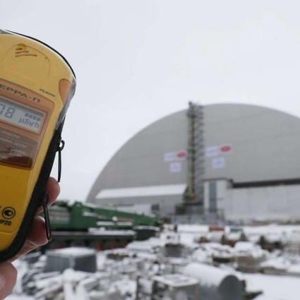 A dosimeter shows the radiation level near a new protective shelter placed over the remains of nuclear reactor Unit 4, at the Chernobyl nuclear power plant in Ukraine, on November 29. The explosion of Unit 4 in the early hours of April 26, 1986, is still regarded as the biggest accident in the history of nuclear power generation. Photo: EPA