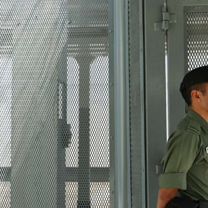 A guard stands watch at Stanley Prison. Photo: Xiaomei Chen