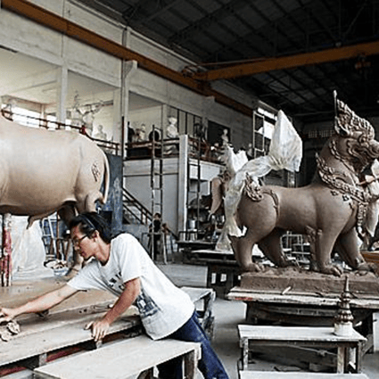 The sculptors fine tune every detail to create a sculpture that befits the royal funeral. Photo: Jetjaras Na Ranong
