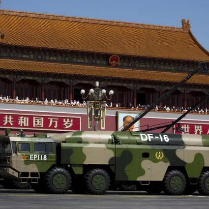 Military vehicles carry DF-16 ballistic missiles past Tiananmen Square during a military parade in Beijing two years ago. Photo: AP