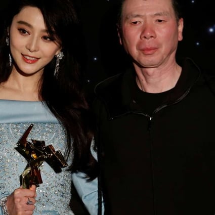 Chinese actress Fan Bingbing and director Feng Xiaogang celebrate with their best actress and best film awards at the Asian Film Awards at the Hong Kong Cultural Centre. Photo: Reuters