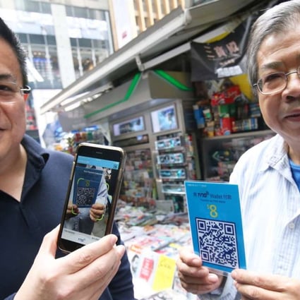 TNG Wallet founder Alex Kong and Coalition of Hong Kong Newspaper and Magazine Merchants chairman Bacon Liu Sair-ching. Photo: David Wong