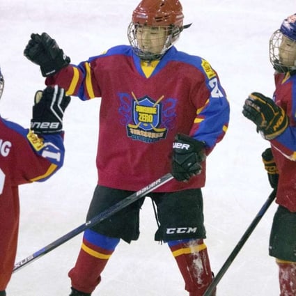 Chinese players high-five each other during a youth ice hockey tournament in Beijing. The National Hockey League sees China as hockey’s next great frontier. Photo: AP