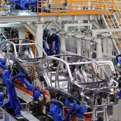 Cars are built at a BYD assembly line in Shenzhen. The company expects sales growth of new energy vehicles to decline this year. Photo: Reuters