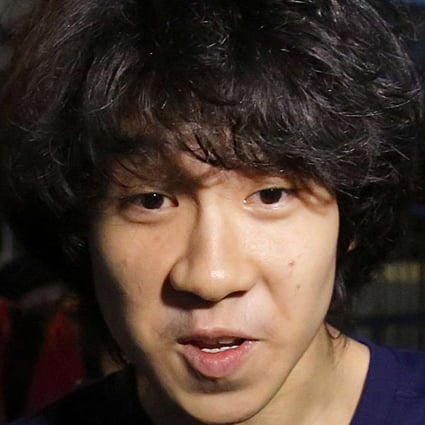 Singapore teen blogger Amos Yee speaks to a reporter while leaving the Subordinate Courts after being released on bail, in Singapore. Yee whose online posts blasting his government landed him in jail, was granted asylum to remain in the United States, but has not been freed. Photo: AP