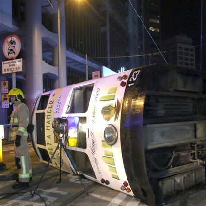 The tram flipped over on Des Voeux Road Central near Bank Street. Photo: Edmond So