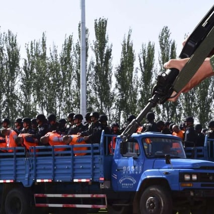A truck carries criminals and suspects to a stadium for a mass sentencing rally in Yili, Xinjiang in this file photo from May 2014. Photo: Reuters