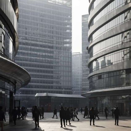 People walk through the Wanjing Soho project in central Beijing. Photo: Bloomberg
