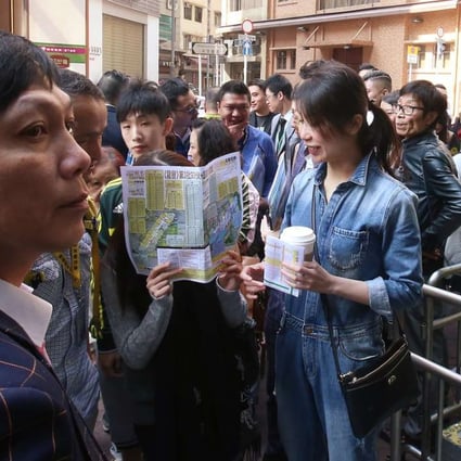 Potential buyers at the sales office of Vibe Centro in Tsim Sha Tsui. Photo: David Wong
