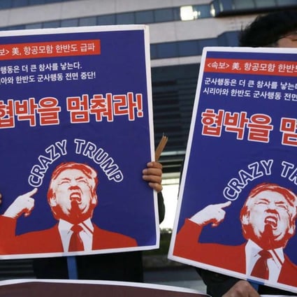 South Korean protesters hold images of US President Donald Trump during a rally denouncing the United States' policy against North Korea near the US. Embassy in Seoul on Wednesday. Photo: AP